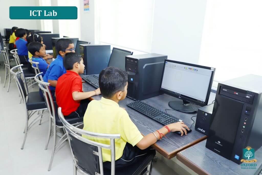 students learning at school computer lab