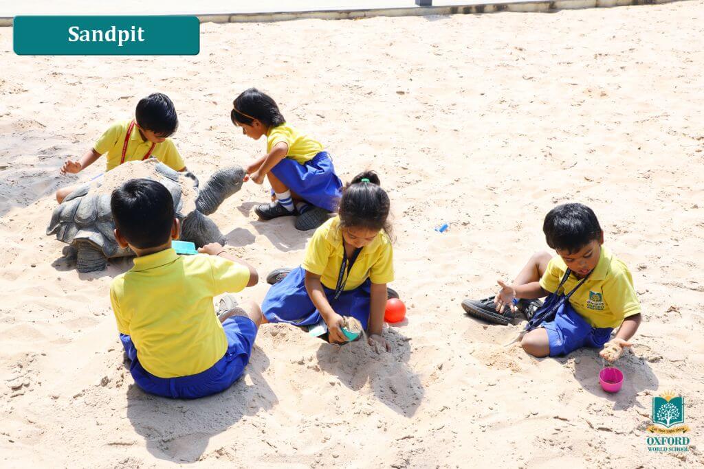 students playing on sand
